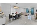 Elegant dining room with a large table and crystal chandelier at 14742 Masthead Landing Cir, Winter Garden, FL 34787