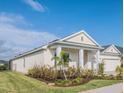 One-story house with a two-car garage and lush landscaping at 17791 Passionflower Cir, Clermont, FL 34714