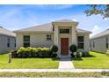 Front view of a single-story house with landscaping at 2340 Grasmere View S Pkwy, Kissimmee, FL 34746