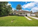 Charming ranch home with stone exterior, spacious yard, and a two-car driveway at 2842 Eastern Pkwy, Winter Park, FL 32789