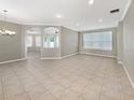 Bright and airy living area with tile flooring and open floor plan at 4957 Rock Rose Loop, Sanford, FL 32771