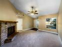 Spacious living area with vaulted ceiling and a cozy fireplace at 511 Cloudcroft Dr, Deltona, FL 32738