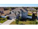 Two-story house aerial view showing the house and surrounding neighborhood at 5417 Calla Lily Ct, Kissimmee, FL 34758