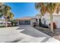 Exterior of the house showing driveway and landscaping at 5942 Nw 26Th Ln, Ocala, FL 34482