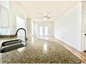 Bright living room with hardwood floors and french doors at 6356 Raleigh St # 1503, Orlando, FL 32835