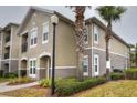 Condo building showcasing architectural details and landscaping at 6554 Swissco Dr # 53, Orlando, FL 32822