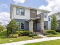 Two-story home with stone accents and landscaped front yard at 6921 Arnoldson St, Orlando, FL 32827