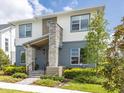 Two-story home with stone accents and landscaped front yard at 6921 Arnoldson St, Orlando, FL 32827