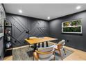 Modern home office with wood desk and gray chairs at 7 1 St Ct, Windermere, FL 34786