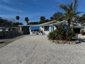 Cute Florida bungalow with blue shutters and a white exterior at 71 Brooks Dr, Ormond Beach, FL 32176