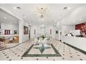 Elegant lobby with modern chandelier and seating at 7383 Universal Blvd # 207, Orlando, FL 32819