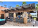 Inviting poolside bar area with ample seating, perfect for socializing and enjoying refreshments at 7383 Universal Blvd # 207, Orlando, FL 32819
