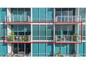 Modern balconies with glass railings, plants, and outdoor seating offer a stylish outdoor living space at 150 E Robinson St # 3104-1, Orlando, FL 32801