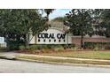 Entrance to Coral Cay Resort with landscaping and signage at 2394 Caravelle Cir, Kissimmee, FL 34746