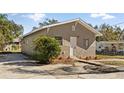 Updated home with a paved driveway and manicured landscaping at 5526 Lily Rd, Lakeland, FL 33811