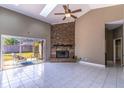 Spacious Gathering room with a fireplace and sliding doors to the backyard at 8967 Palos Verde Dr, Orlando, FL 32825