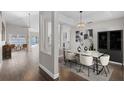 Bright dining room with a contemporary chandelier and modern furnishings at 1027 Sweetbrook Way, Orlando, FL 32828