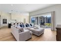 Open living space with sectional sofa and view of the backyard at 20344 Sheldon St, Orlando, FL 32833