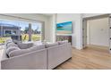 Living area featuring a sectional sofa and sliding glass doors at 20344 Sheldon St, Orlando, FL 32833
