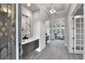 Bright and airy entryway with a spacious feel and elegant light fixture at 2423 Hyatt Creek Ln, Port Orange, FL 32128