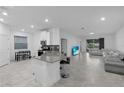 Open concept kitchen with island, stainless steel appliances, and breakfast nook at 3087 Camden Way, Davenport, FL 33837