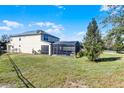 Large backyard with solar panels and screened-in pool area at 8729 Eden Cove Dr, Winter Garden, FL 34787