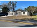 New construction home showcasing a modern exterior with stone accents at 102 Colomba Rd, Debary, FL 32713