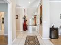 Bright and spacious entryway with tile flooring and a large vase at 1318 Lucky Pennie Way, Apopka, FL 32712