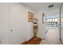 Bright hallway with hardwood floors and access to powder room at 150 E Robinson St # 14A, Orlando, FL 32801