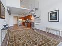 Open living area with spiral staircase and loft at 150 E Robinson St # 14A, Orlando, FL 32801