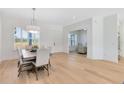 Light and airy dining room with hardwood floors and a view into another living space at 20316 Sheldon St, Orlando, FL 32833