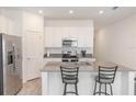 Modern kitchen with stainless steel appliances and an island at 2037 Freemark St, Osteen, FL 32764