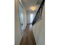 Bright entryway with wood-look floors and modern staircase at 2229 Valentine Aly, Orlando, FL 32804