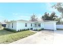 Newly renovated light teal single story home with attached garage at 30 Old Barn Way, Casselberry, FL 32707