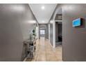 Bright and spacious hallway with tile floors and arched doorways at 3101 Royal Tern Dr, Winter Haven, FL 33881