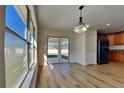 View of backyard from dining room with sliding glass doors at 3342 Saint Vincent Ln, Clermont, FL 34711