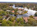 An aerial view of a house located on a lake at 4832 Shoreline Cir, Sanford, FL 32771