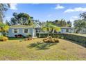 Charming ranch home with well-manicured lawn and mature landscaping at 5408 Kalmia Dr, Orlando, FL 32807