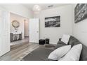 Gray sectional sofa, wood-look floors, and entryway view at 6145 Citrus Grove Ct, St Cloud, FL 34771