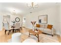 Open concept dining area with seating for four and modern light fixture at 7884 Broken Arrow Trl, Winter Park, FL 32792