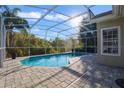 Inviting screened-in pool with ample patio space at 9451 Brownwood Ct, Oviedo, FL 32765