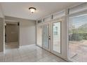 Light-filled entryway with tile flooring and access to backyard at 106 Canterbury Dr, Haines City, FL 33844