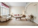 Bright living room featuring ivory sofas and a wood coffee table at 2920 River Birch Dr, Kissimmee, FL 34741