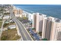 Aerial view of oceanfront building and surrounding area at 3311 S Atlantic Ave # 1402, Daytona Beach, FL 32118