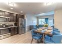 Modern kitchen with stainless steel appliances and dark wood cabinets at 4012 Breakview Dr # 405, Orlando, FL 32819