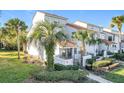 Side view of townhome showcasing the building's architecture and landscaping at 4818 Marks Ter # 385 B2, Orlando, FL 32811