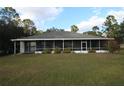 Home exterior showcasing a screened porch at 560 Eden Dr, St Cloud, FL 34771