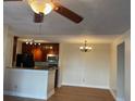 Dining area with wood-look flooring and a chandelier at 6106 Westgate Dr # 103, Orlando, FL 32835