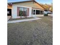 House exterior view, featuring a yard and driveway at 6133 Olympic Ct, Orlando, FL 32808