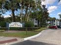 Clubside community entrance with building and parking area visible at 8203 Olympia Ct # 8203, Longwood, FL 32779